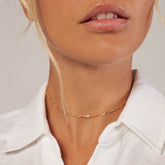 14k Yellow Gold Paper Clip Choker Chain on woman's neck